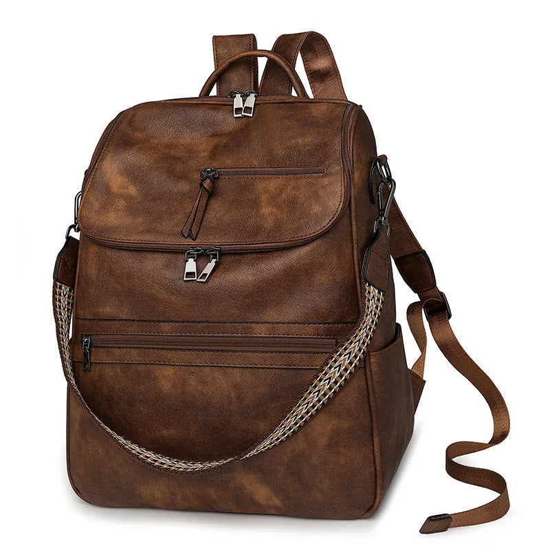 Retro college student backpack with curved shoulder straps in six colour options including black, blue and brown variations
