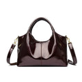 Genuine leather commuter bag with glossy finish, belt decoration, and leather grain in a horizontal square shape