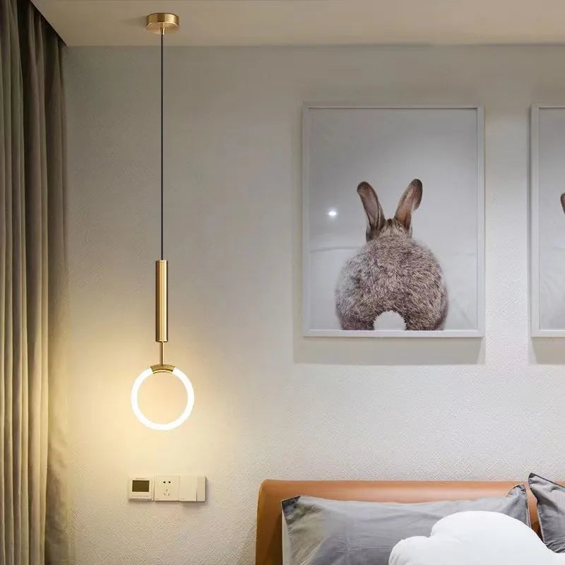 Modern Nordic-style U-shaped pendant chandelier light in a bedroom setting, showing compact 200mm design.