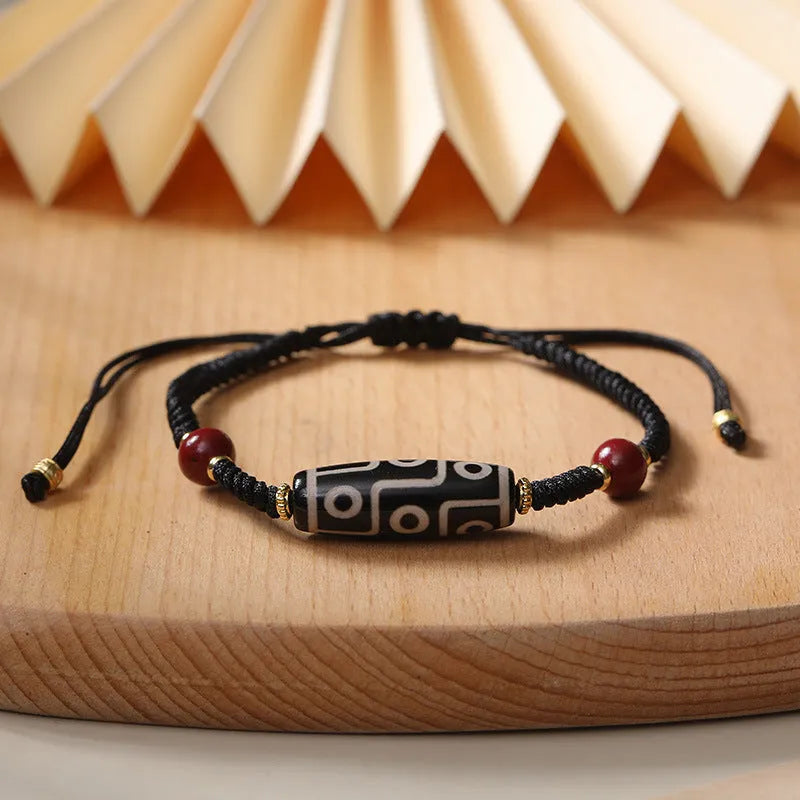 Men's shrinkable agate bracelet with Tibetan Dzi bead patterns on a wrist