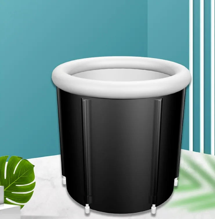 Black inflatable portable ice bath tub with elasticated cover, shown with air pump and drainage accessories