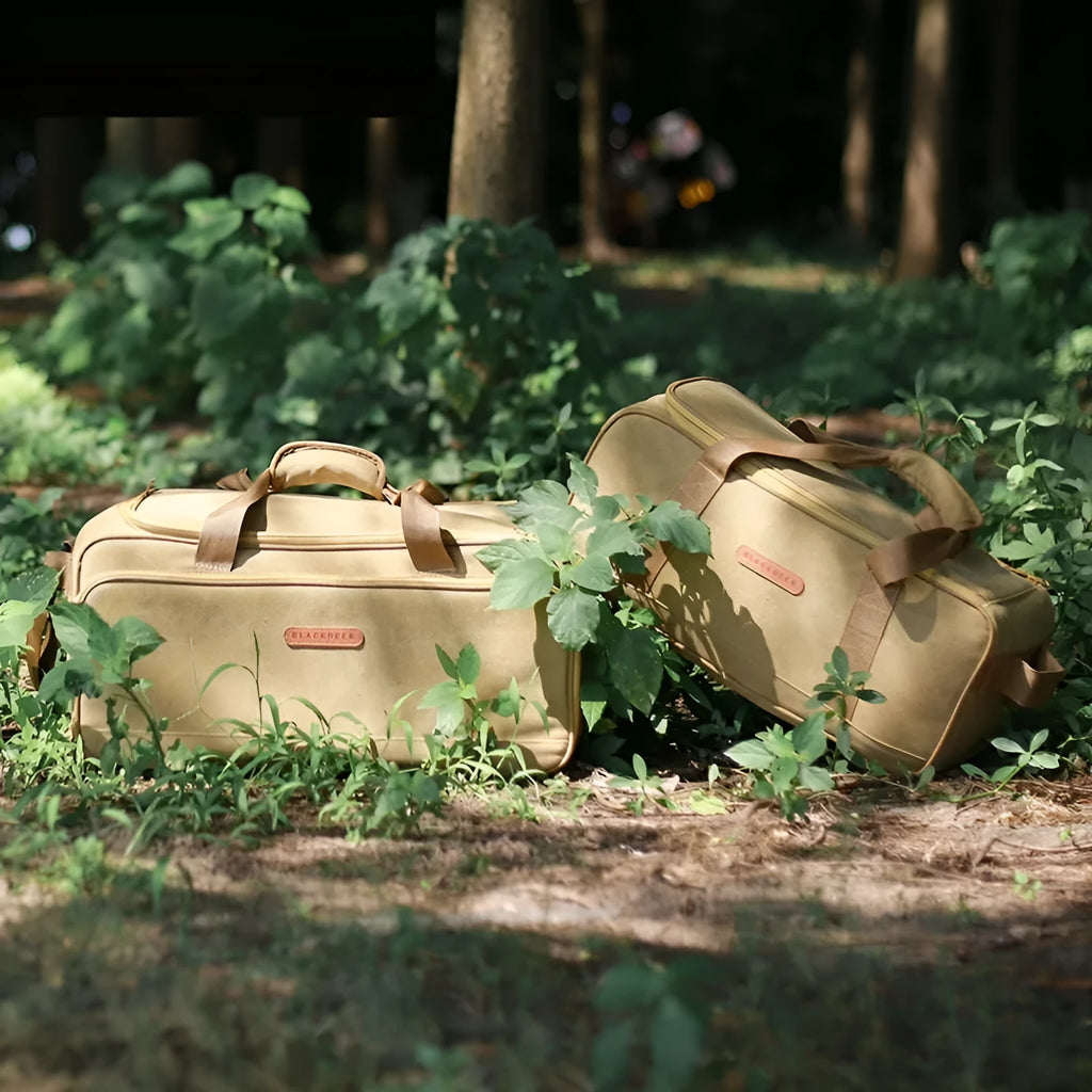 Oxford cloth camping cookware storage bag shown in two sizes, 16 litre and 35 litre, for portable stoves.