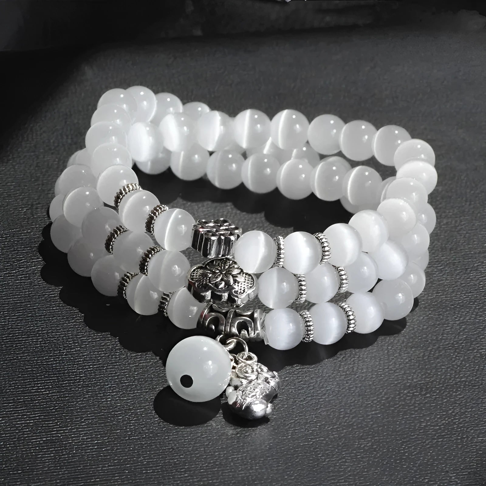 Opal crystal bracelet with geometric cat eye design showing three wraps around wrist