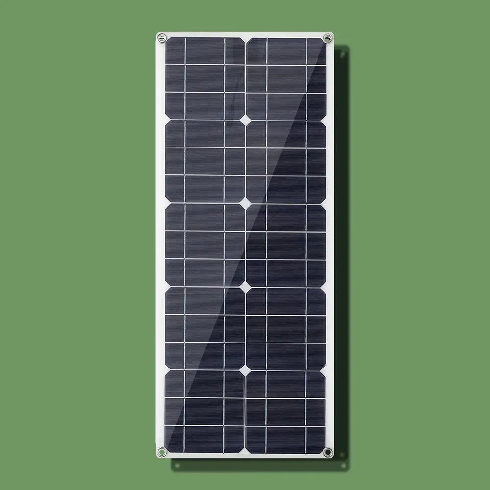 30W semi-flexible black solar panel showing USB port and output cables on a textured surface.