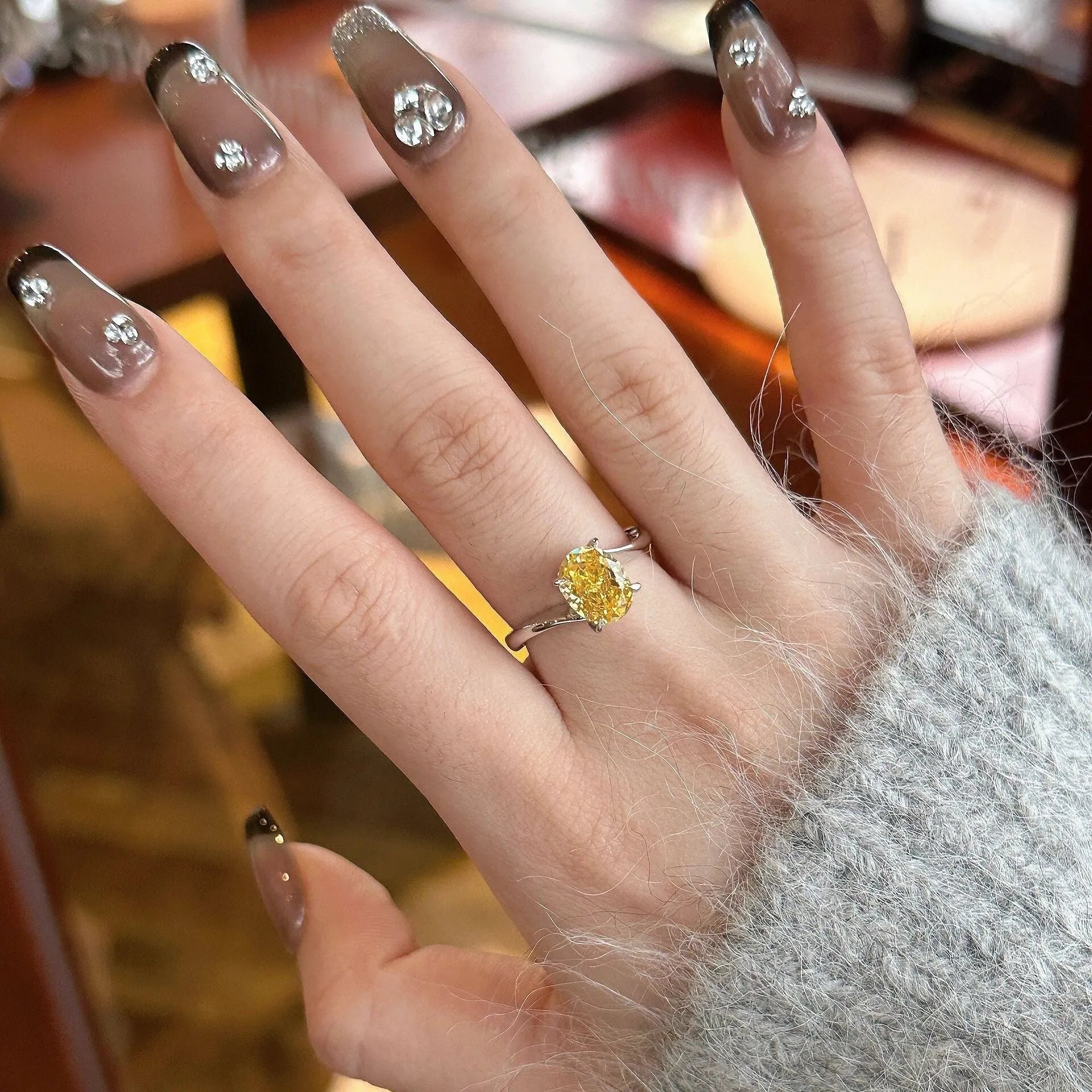 Women's yellow rock sugar crystal ring in copper with Seiko treatment showing band and distinctive colour design