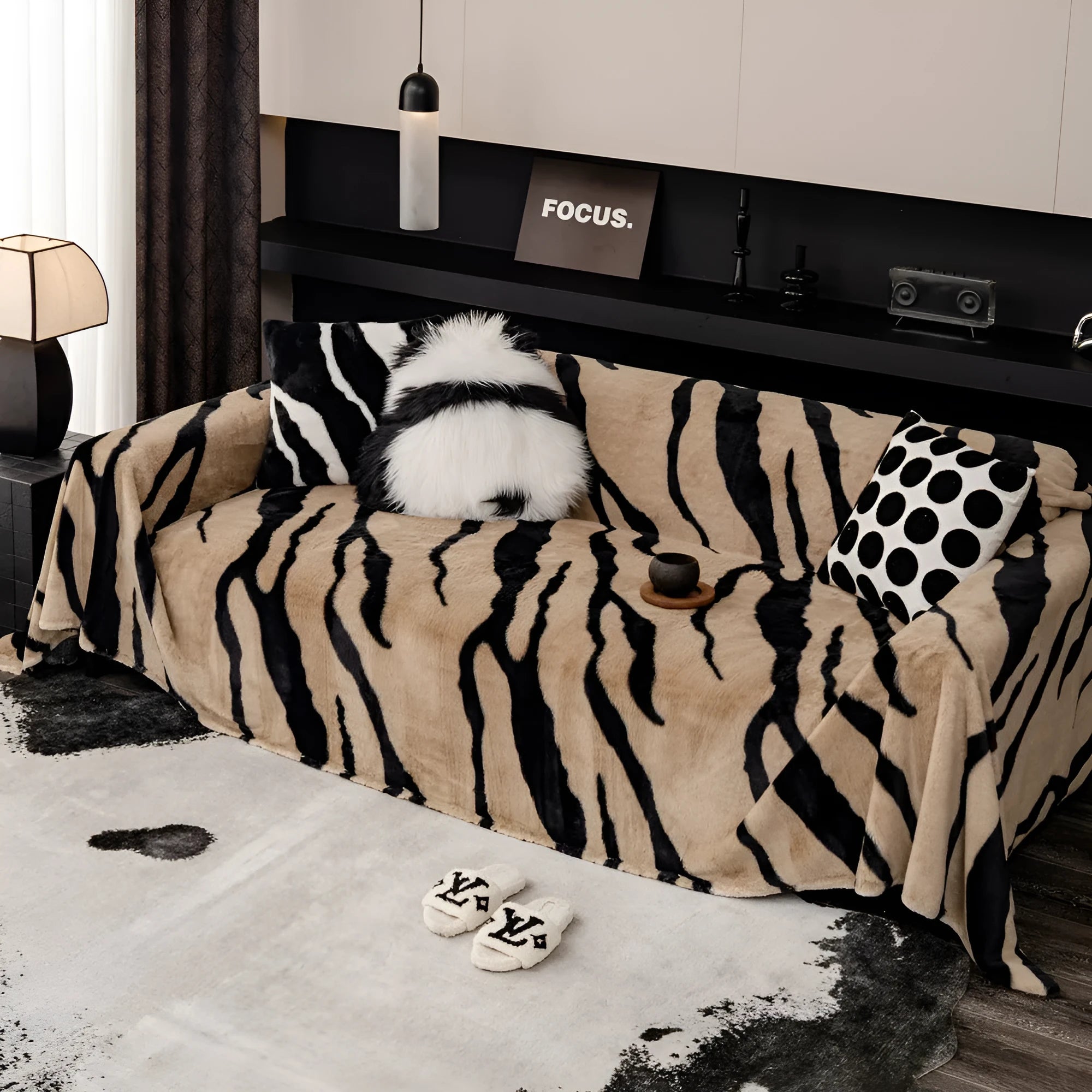 Zebra pattern flannel sofa cover with matching pillowcase on a sofa.
