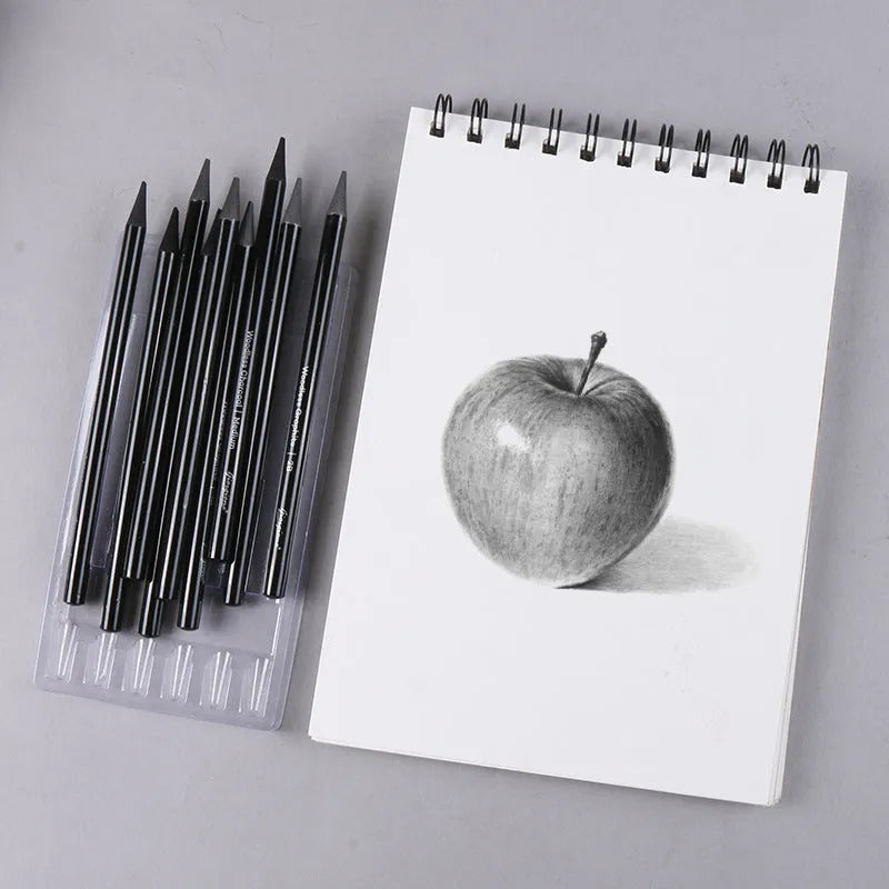 Set of six graphite and three carbonized pencils with wooden casings on a retail suction card.