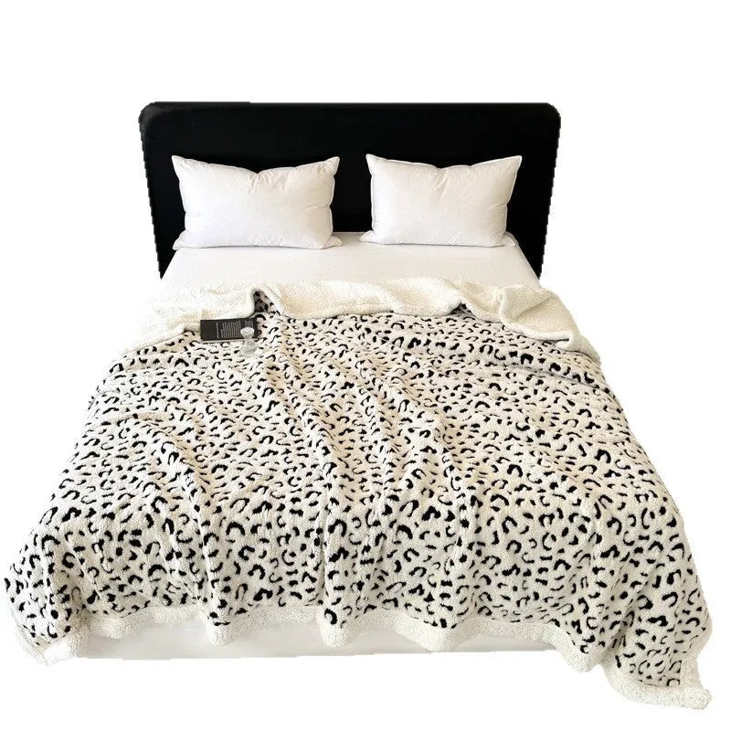 Double-layer cationic jacquard taffeta blanket with leopard print pattern in camel colour.