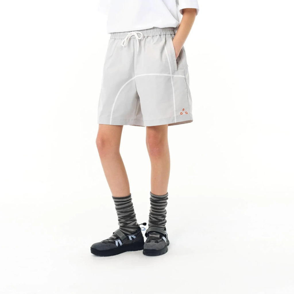 Men's dark grey elastic polyester drawstring shorts with loose fit on a white background.