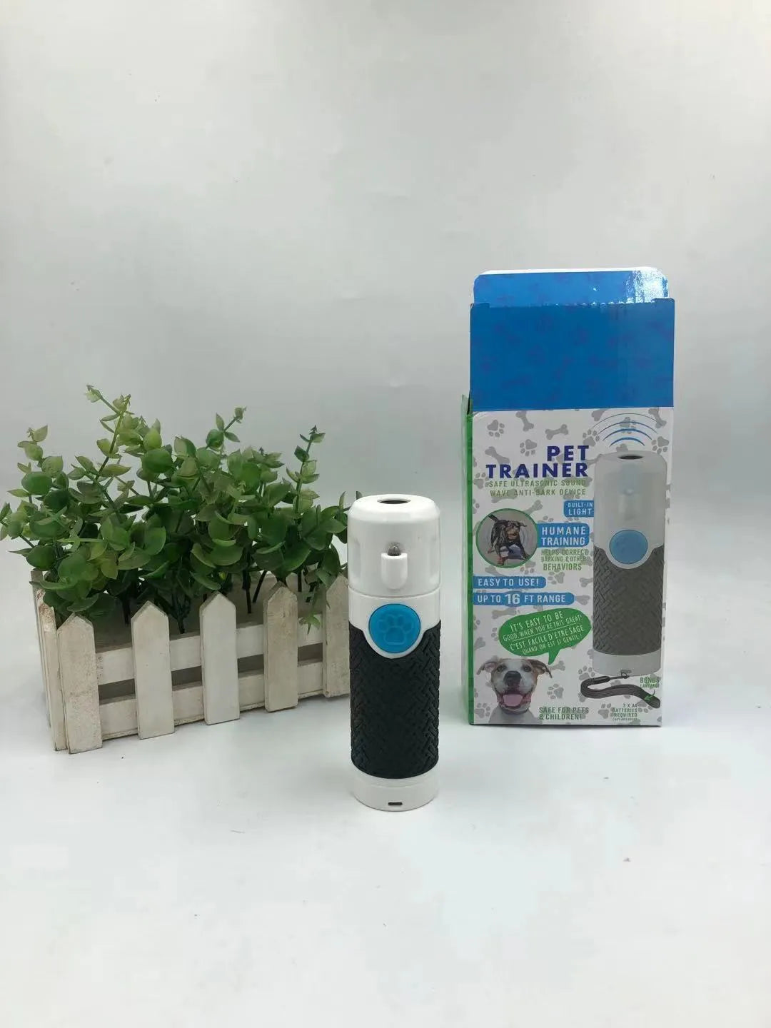 White handheld ultrasonic dog trainer device with LED indicator for bark control