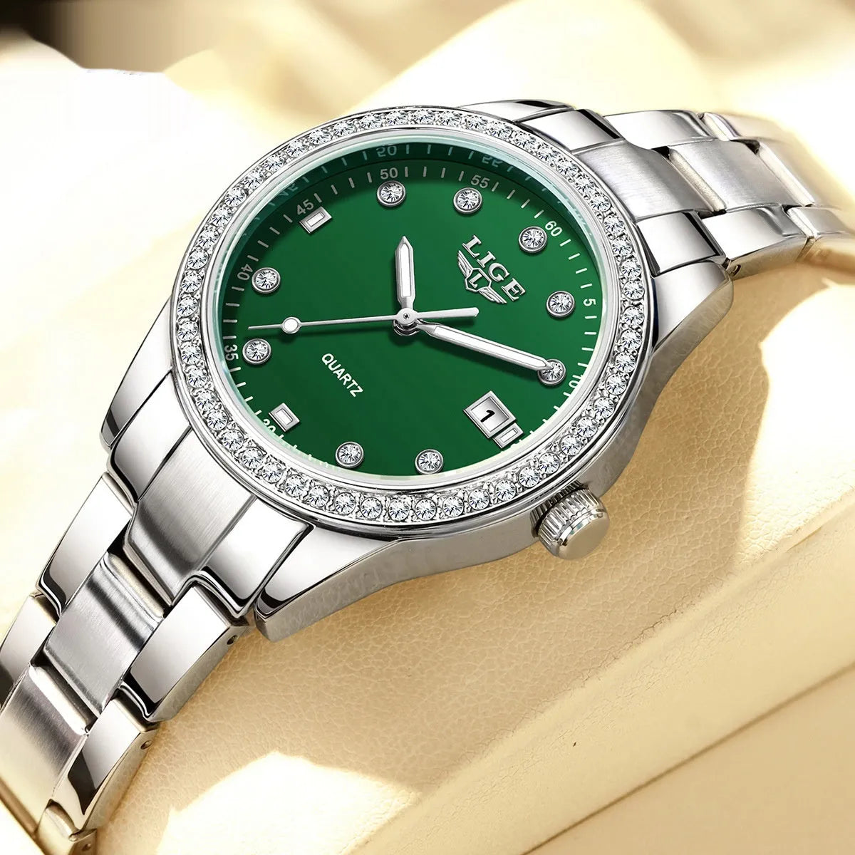 Women's silver fashion watch with diamond bezel and coloured dial on stainless steel strap.
