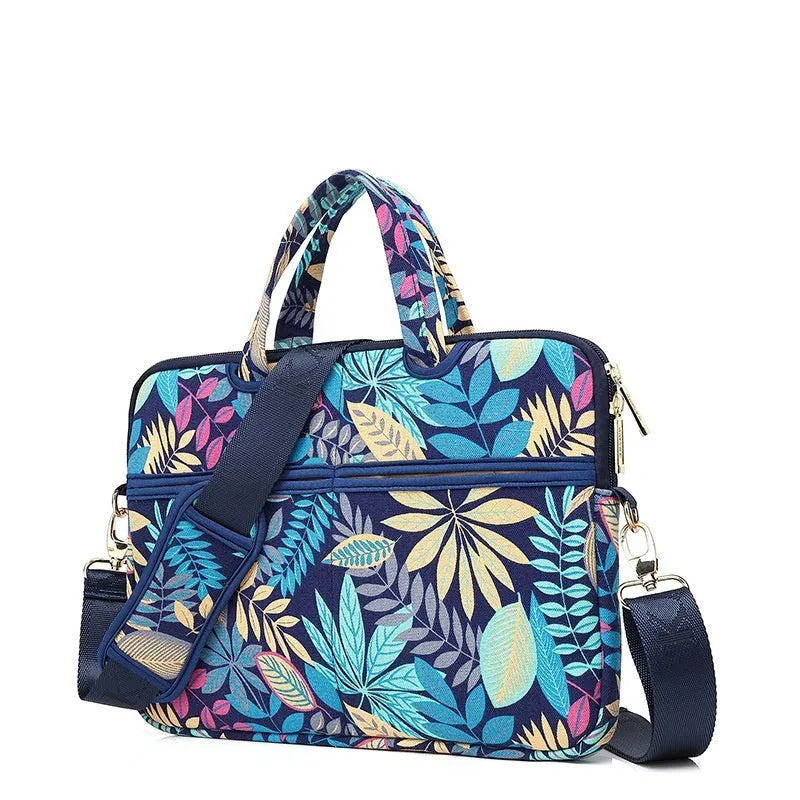 Canvas laptop sleeve with printed pattern for 13-15 inch notebooks, plush lining, and padded shoulder strap