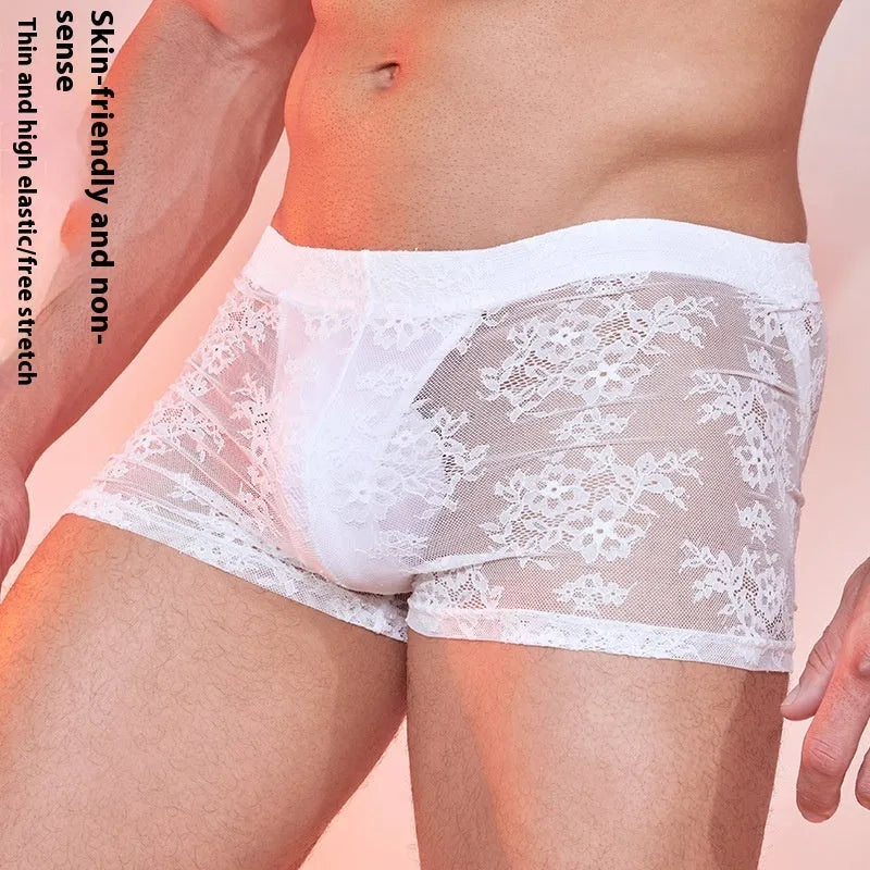 Men's black boxer briefs with a decorative white lace trim detail along the leg opening.
