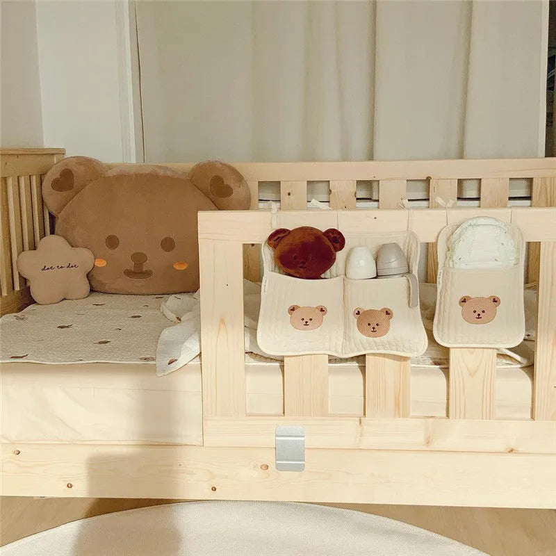 Cotton cloth hanging storage bag for baby bottles and diapers, available in six colours including bear, olive, and tulip