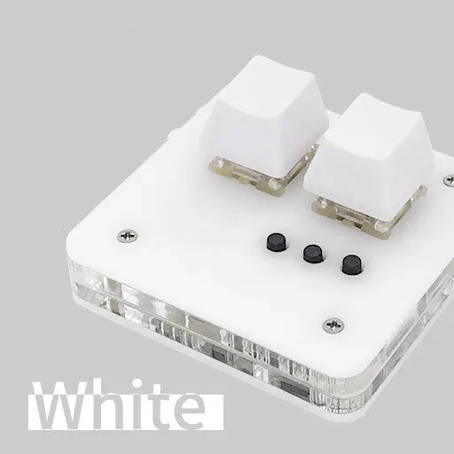 Compact white USB keyboard with a touch panel and multimedia function keys on a desk.