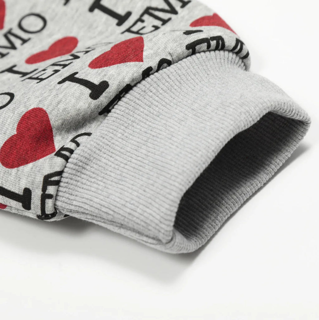 Women's melange grey hooded cotton cardigan with a retro pattern, shown on a model.