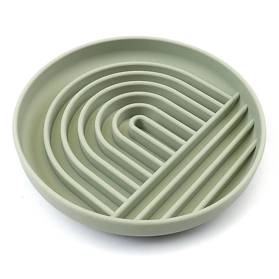 Silicone slow feeder dog bowl with textured ridges, shown in beige colour on a wooden surface.