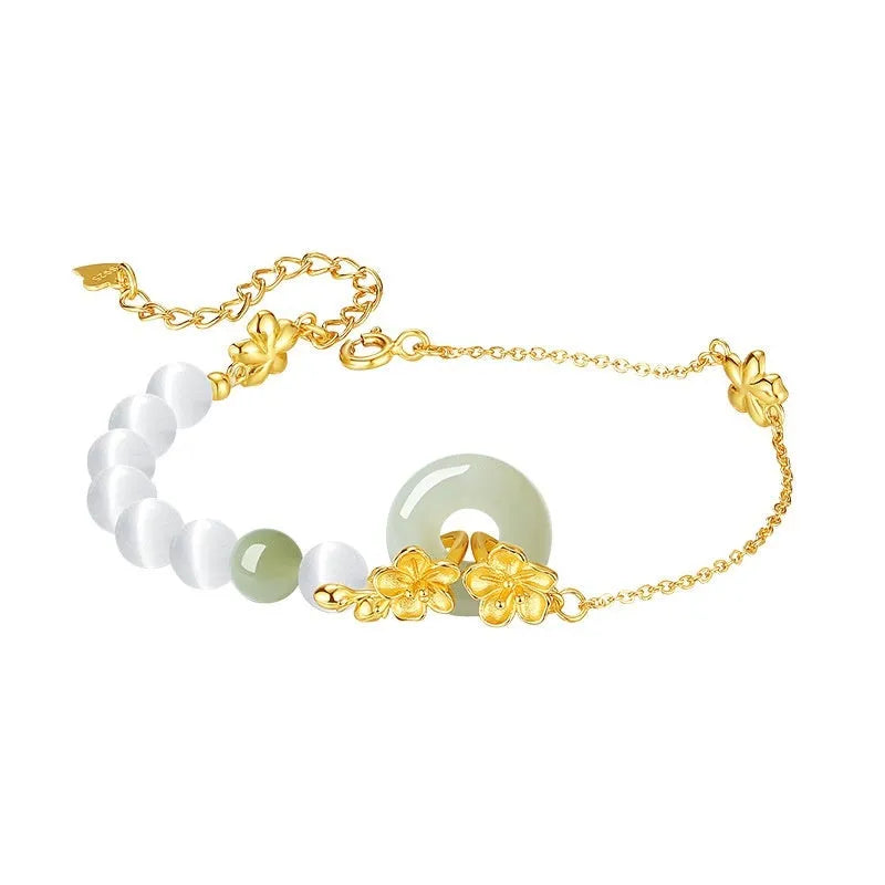 Pure silver peach blossom bracelet for women with a safety buckle clasp in gold or white gold colour.