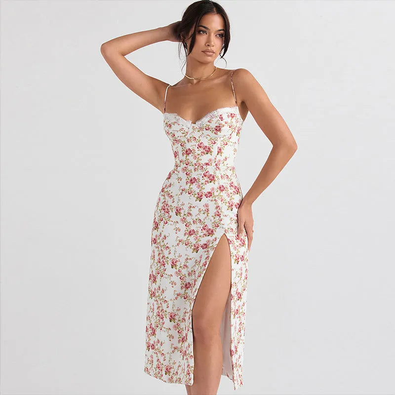 Women's blue lace flower print long suspender dress with a high leg slit on a model.