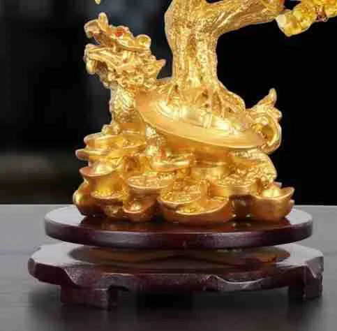 Citrine-coloured resin ornament of a turtle money tree in Chinese Feng Shui style.