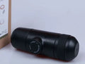 Black portable manual coffee machine with compact 6x17.5cm dimensions