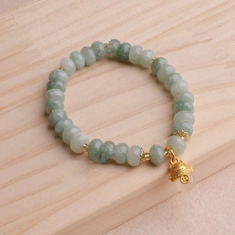 Women's strawberry quartz bracelet with lucky cat charm and animal zodiac modelling in retro style