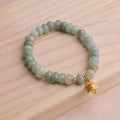 Women's strawberry quartz bracelet with lucky cat charm and animal zodiac modelling in retro style