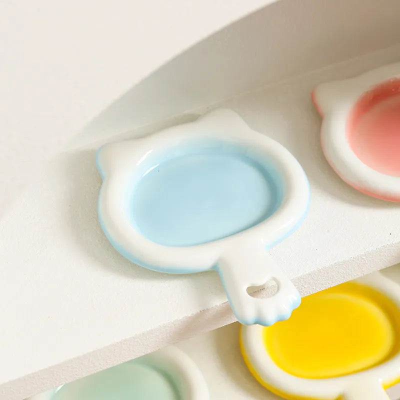Ceramic cat food bowl with non-slip silicone base in blue, green, pink, or yellow colour options