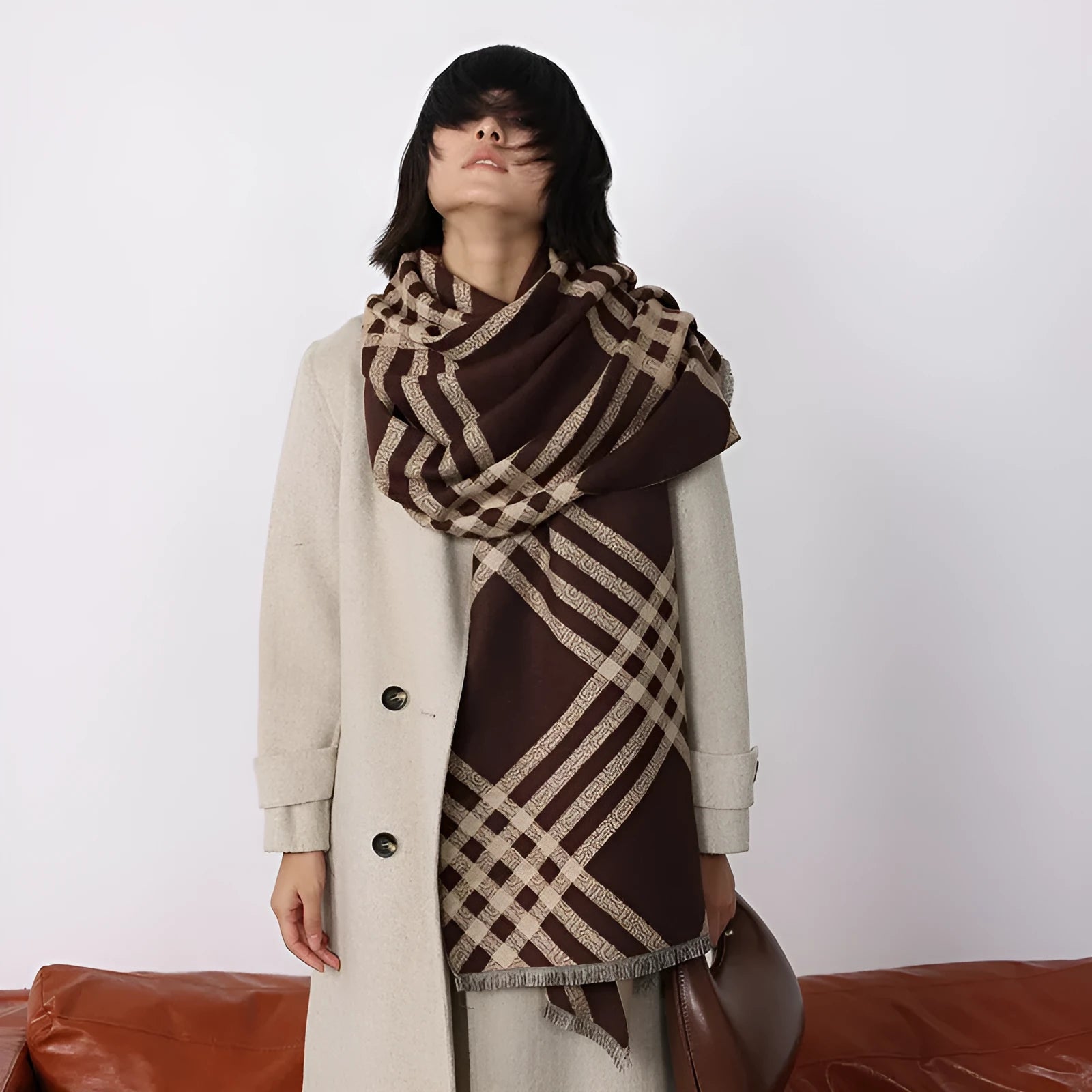 Qianjin mid-length brown imitation cashmere scarf with tassels laid flat showing 185cm length.