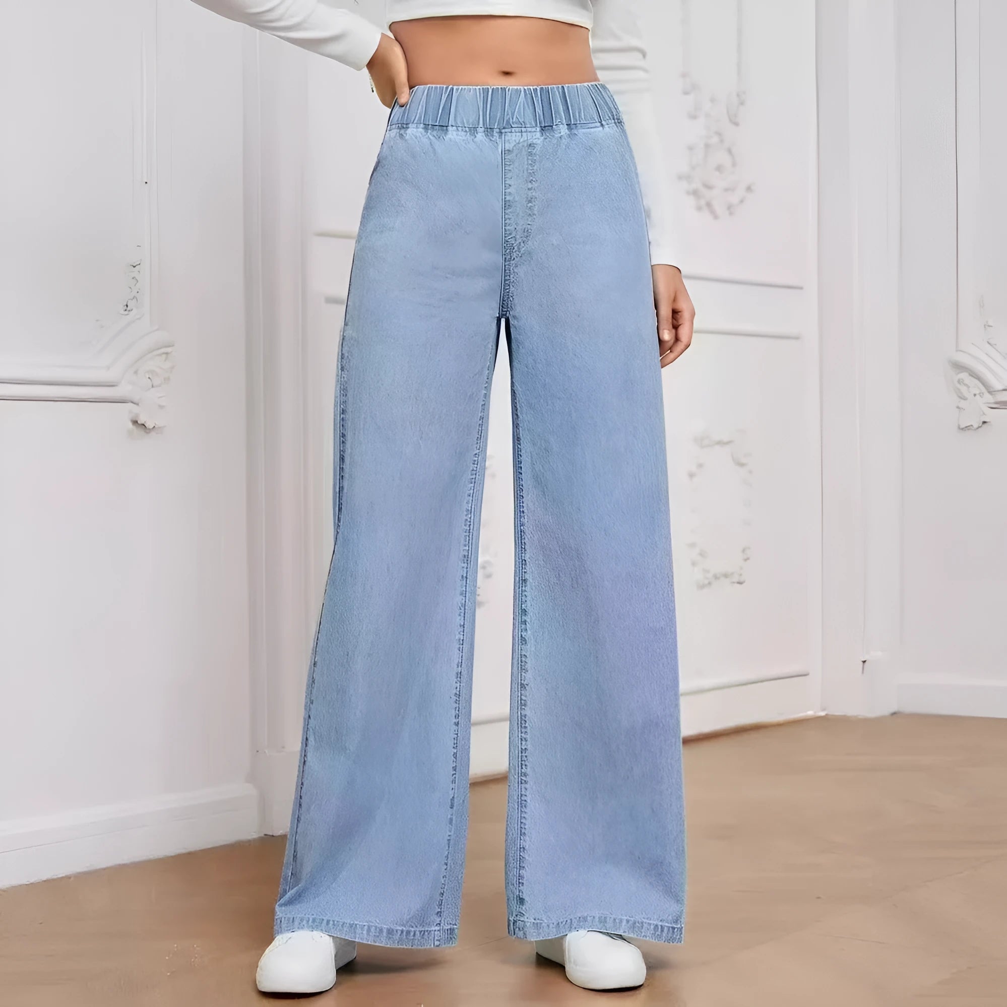 Light blue washed wide-leg denim trousers with straight silhouette and zip-fly placket