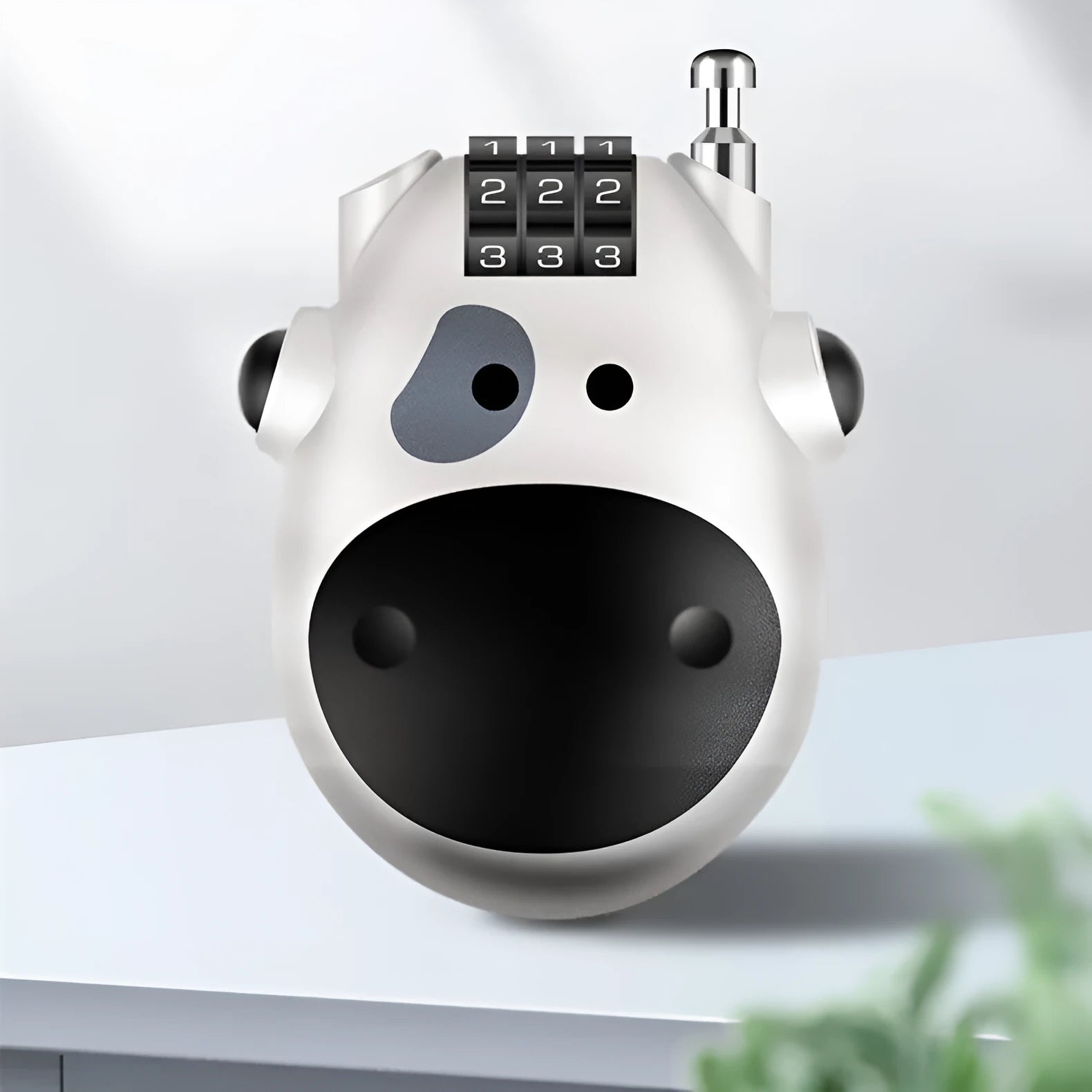 Retractable motorcycle helmet lock with extended steel cable next to bicycle helmet
