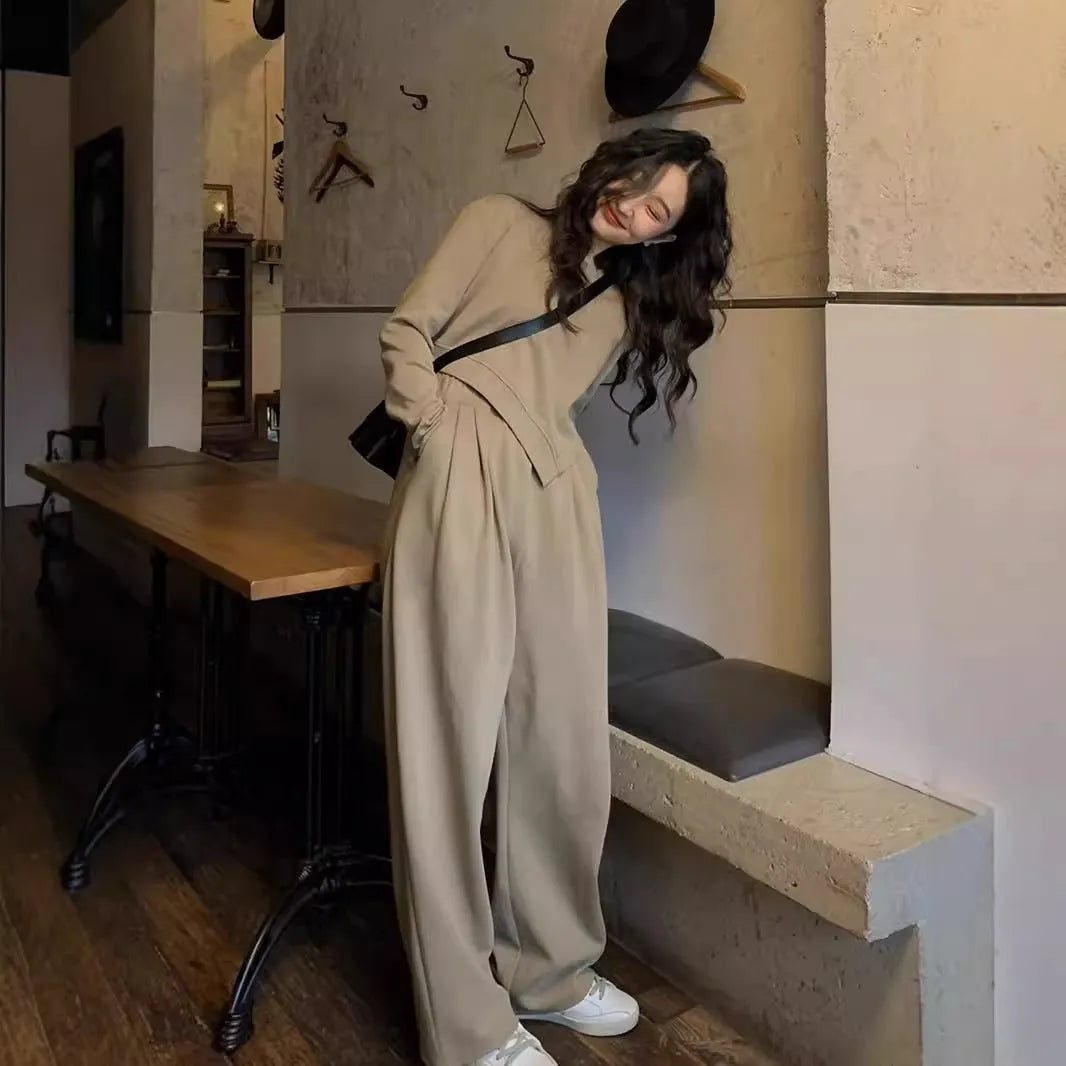 Women's khaki loose-fit polyester sports suit with long sleeves and full-length trousers.