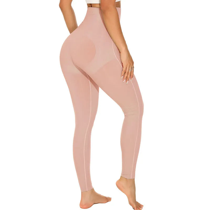 Women's black seamless yoga trousers with high waist, showcasing abdominal support and adjustable design for fitness.