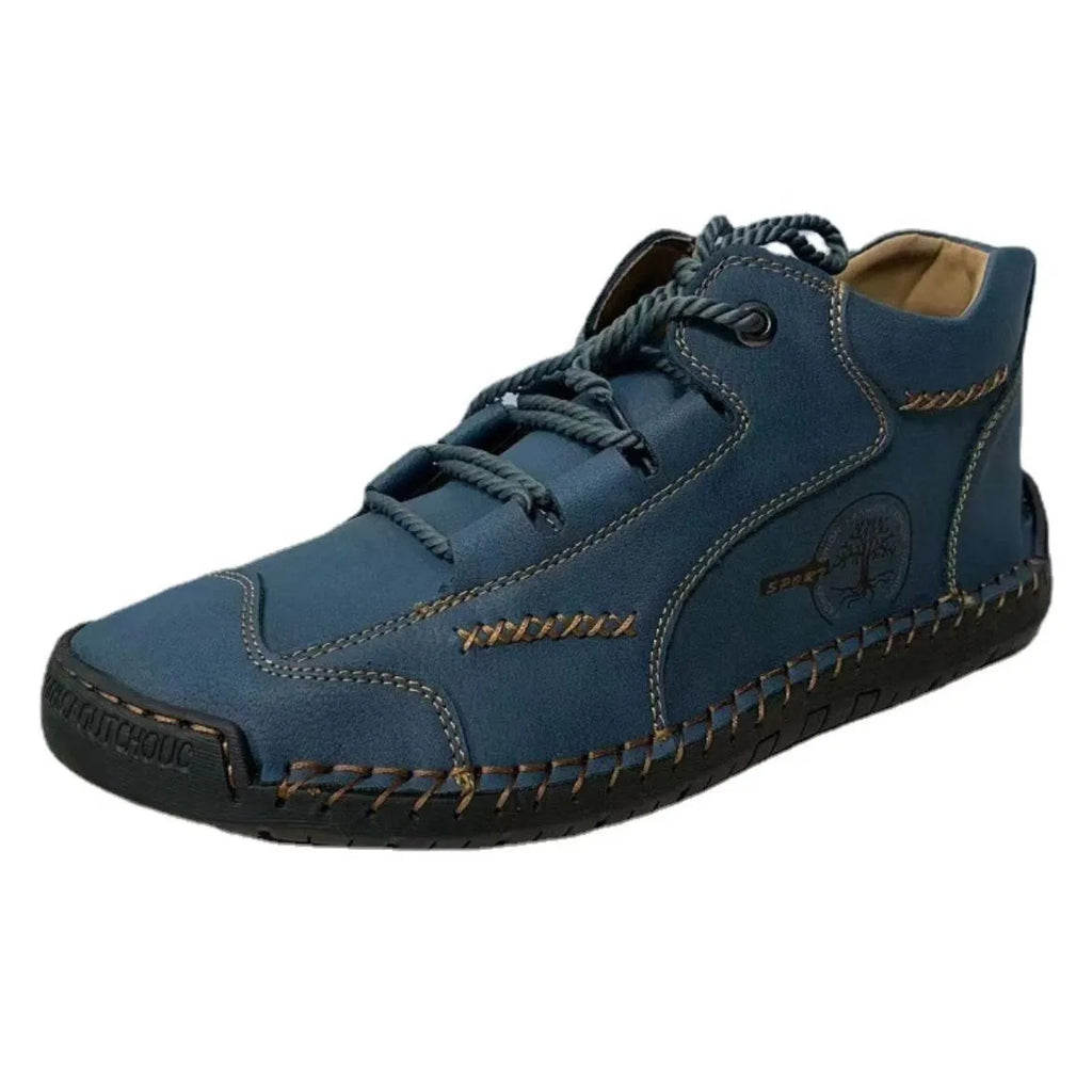Men's brown leather high-top boots with visible stitching and flat rubber sole on a neutral background.
