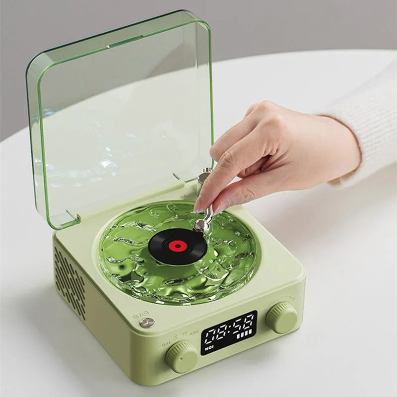 Retro turntable Bluetooth speaker with rotating transparent disc and RGB lighting effects