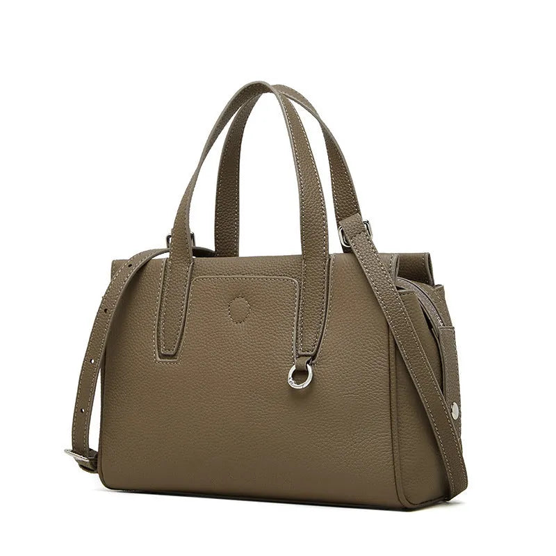 Genuine leather crossbody bag in horizontal square design with single strap, shown in black colour option.