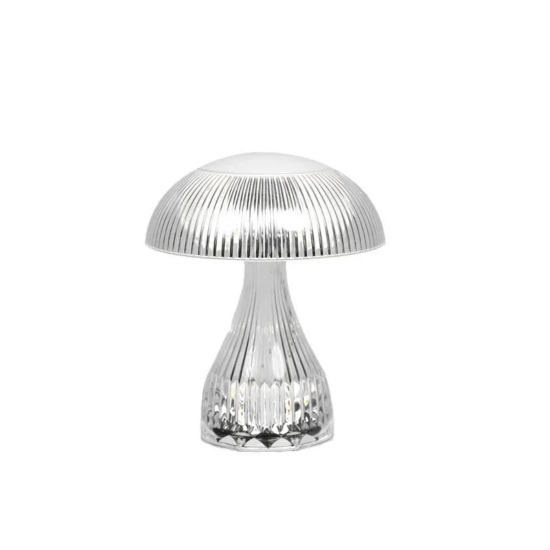 Small white rechargeable night lamp with USB port and colour-changing LED light on a table.
