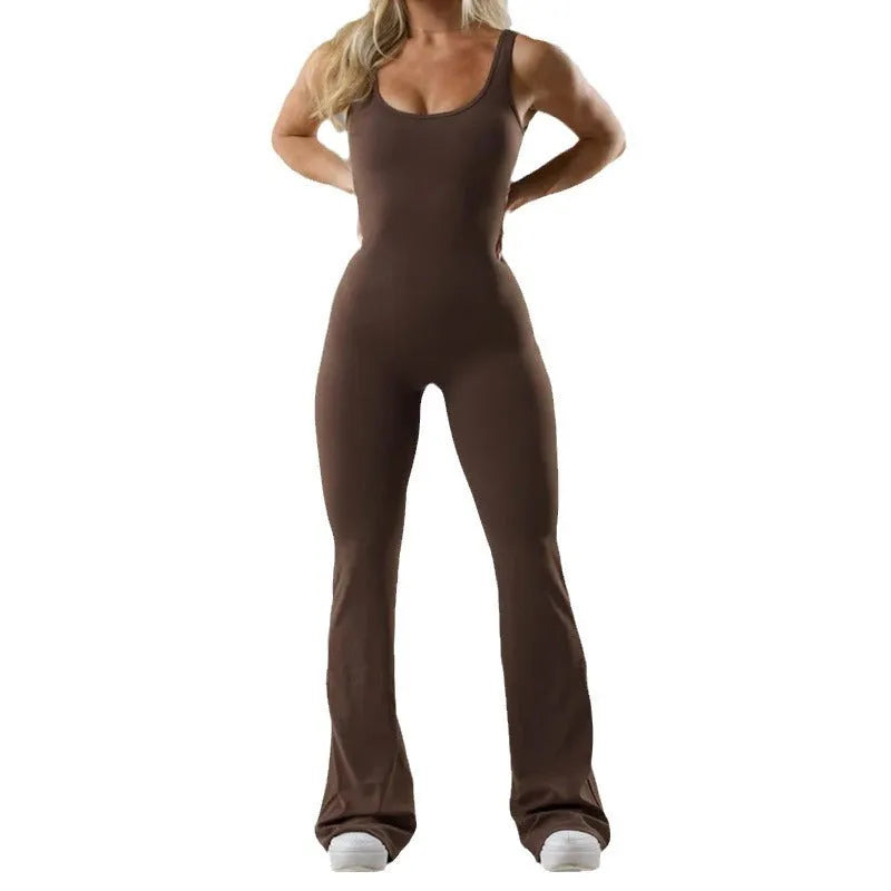 Women's seamless milk silk yoga bodysuit in black with built-in chest pads and full-length trousers.