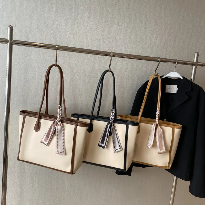 Soft PU leather commuter tote bag showing open outer pockets and horizontal square design