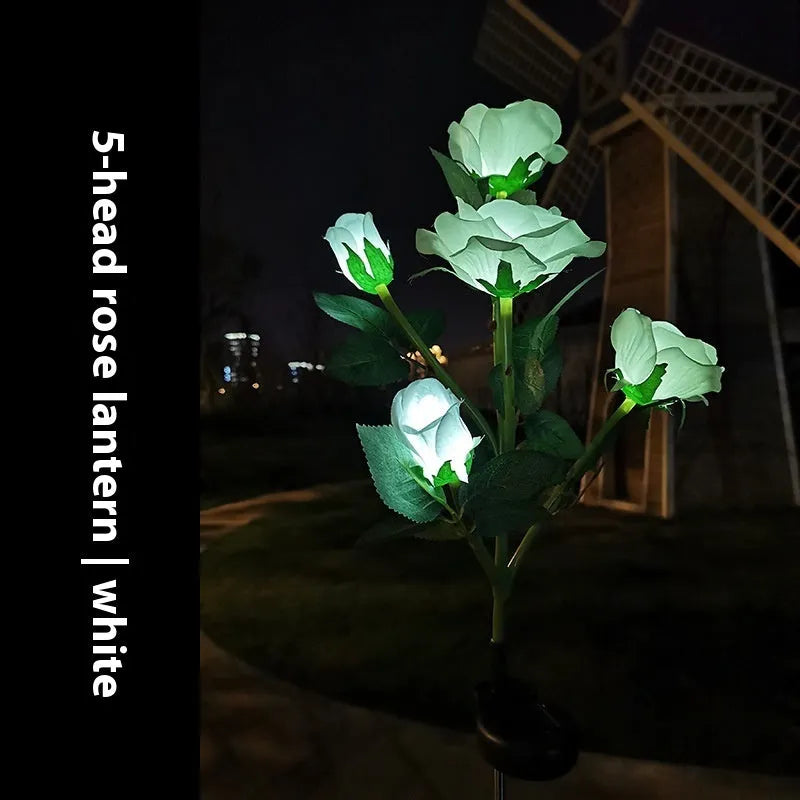 Colour LED solar-powered flower-shaped ground lamp for garden lighting.