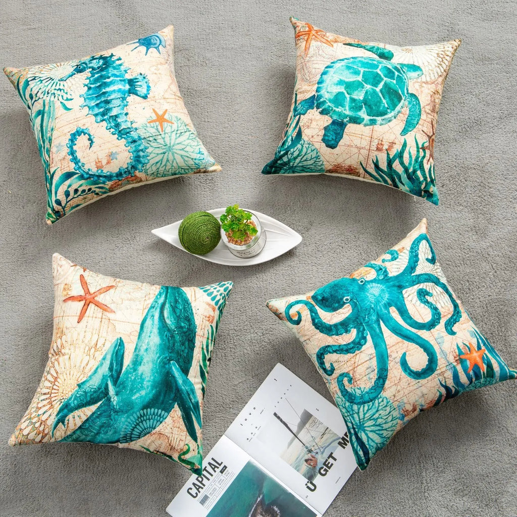 Linen cushion cover with detailed sea turtle print, measuring 45x45cm, on a sofa.