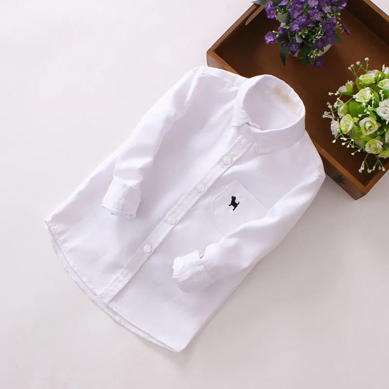 Boy's blue long sleeve cotton shirt with a lapel collar on a hanger.