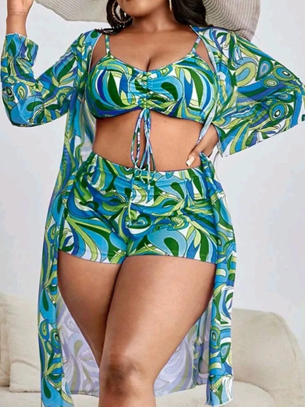 Women's floral print bikini set with underwire bra, high-waisted briefs, and a sheer cover-up cardigan.