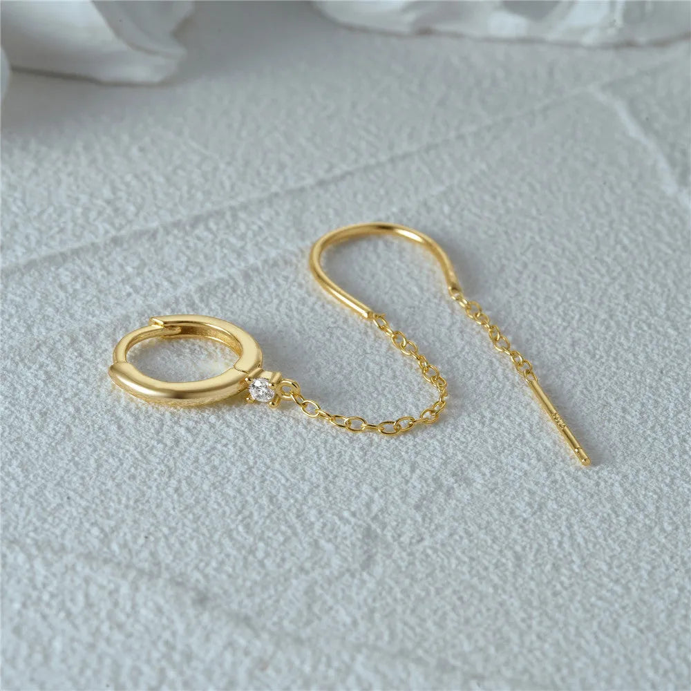 S925 sterling silver ear studs with geometric flower design and tassel chain elements in golden colour