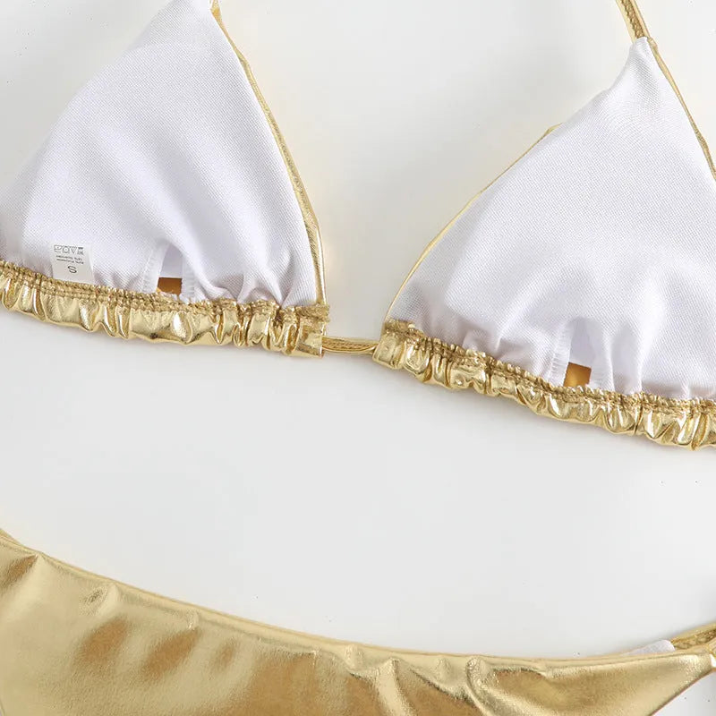 Women's gold lace-up bikini made from polyester fabric, shown on a size mannequin.