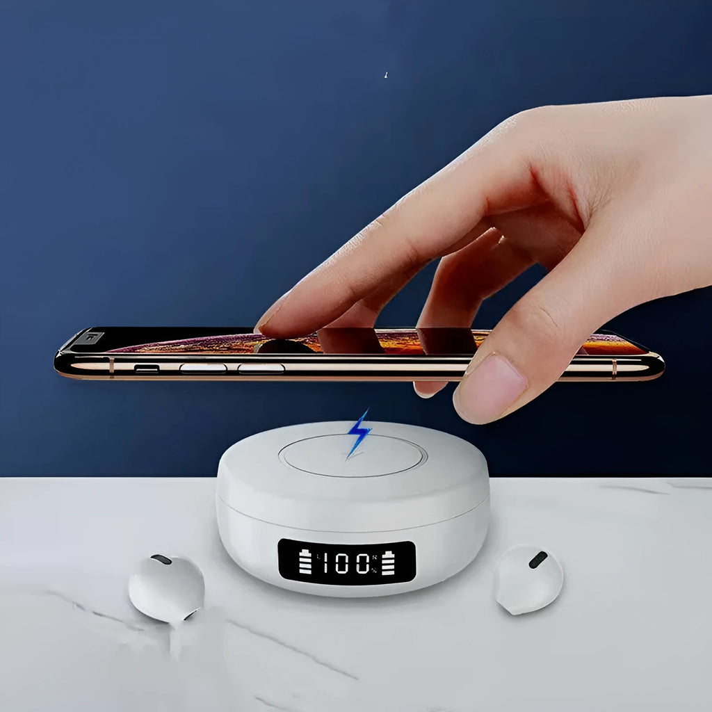 Pair of small black semi-in-ear wireless headphones sitting inside a white charging compartment with lid open.