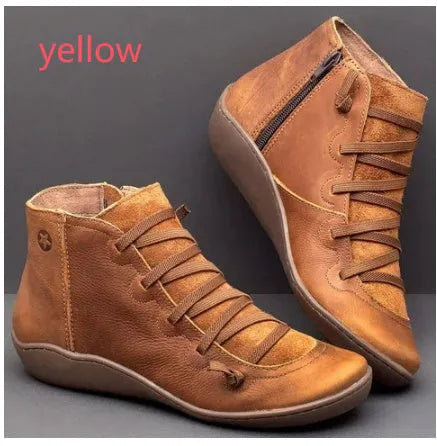Women's casual flat ankle boots in artificial PU leather with a round toe and wedge rubber sole.