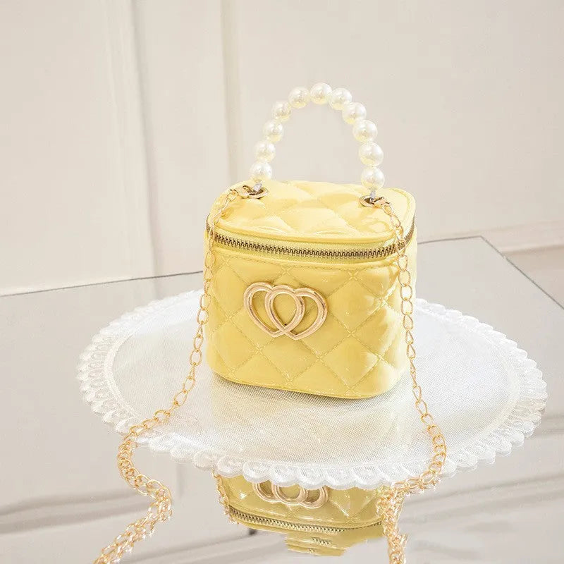 PVC bucket-shaped gel bag for women with a heart pattern, shown in apricot colour.
