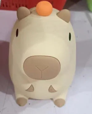 Capybara-shaped silicone night lamp with USB charging port and compact dimensions
