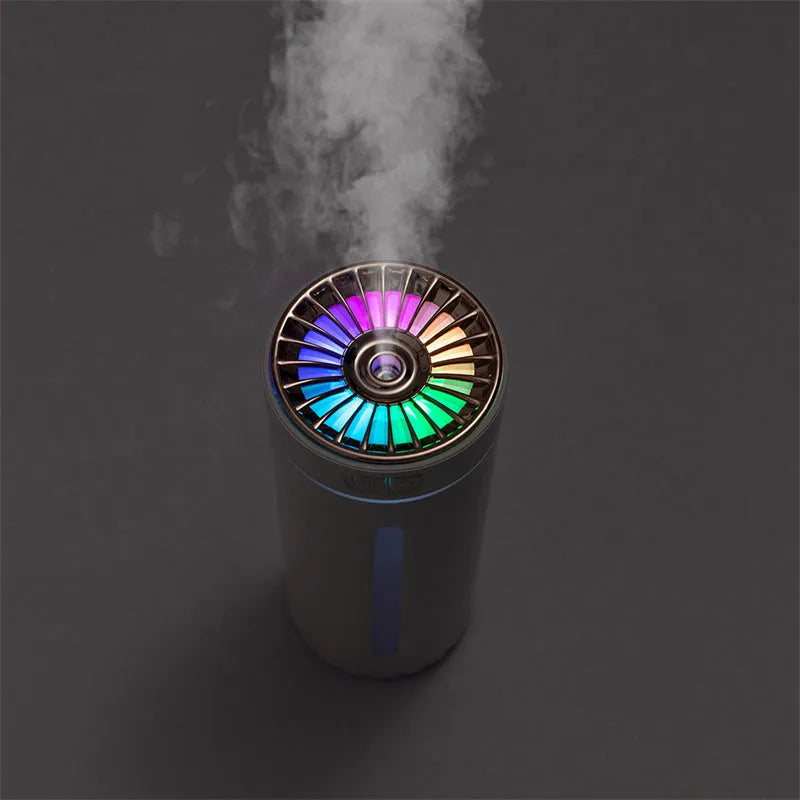 Black USB car humidifier with LED lights placed in vehicle cup holder showing mist output